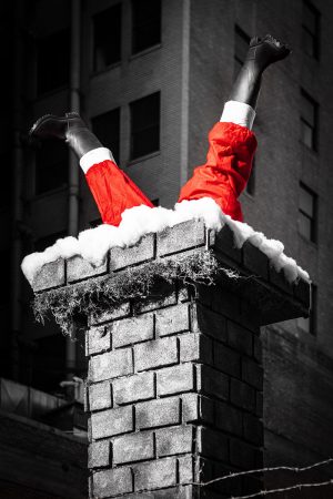 black and white photograph with a splash of red. Santa's Last Stand