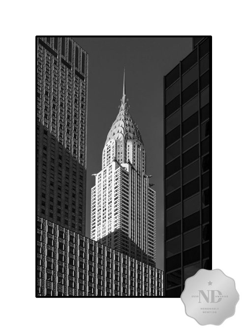 black & white photo of Chrysler Building with award