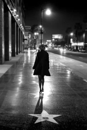 A woman struts down the Walk of Fame in Hollywood